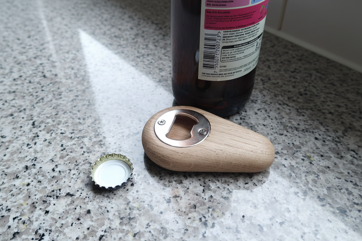 Wooden bottle opener on granite countertop